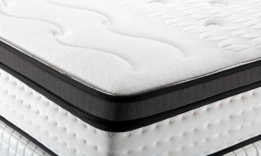 A white mattress with black line around the edge